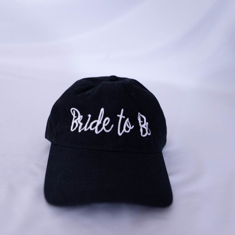 Black Baseball Cap Bride To Be (Cursive, white embroidered letters)
